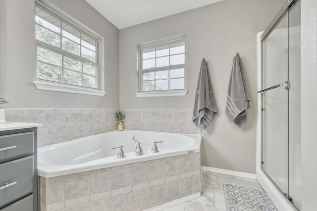 287 Appletree Dr, Ozark, MO 65721 - bathroom featuring a bath, vanity, a stall shower, and marble look tile flooring