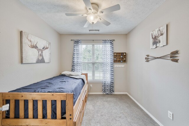 287 Appletree Dr, Ozark, MO 65721 - bedroom featuring a textured ceiling, carpet floors, baseboards, and ceiling fan