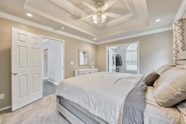 287 Appletree Dr, Ozark, MO 65721 - bedroom with a tray ceiling, ornamental molding, light carpet, recessed lighting, and a spacious closet