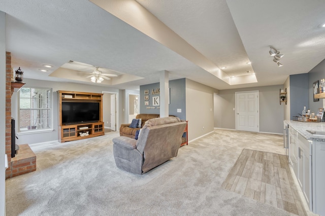 287 Appletree Dr, Ozark, MO 65721 - living room featuring a tray ceiling, baseboards, light carpet, a ceiling fan, and recessed lighting