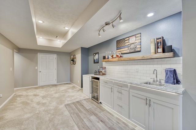 287 Appletree Dr, Ozark, MO 65721 - indoor bar with beverage cooler, tasteful backsplash, baseboards, recessed lighting, and a raised ceiling