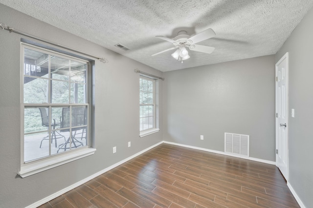 287 Appletree Dr, Ozark, MO 65721 - unfurnished room featuring baseboards, ceiling fan, dark wood finished floors, and a textured ceiling