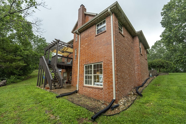 287 Appletree Dr, Ozark, MO 65721 - back of property featuring stairway, a pergola, a chimney, brick siding, and a yard