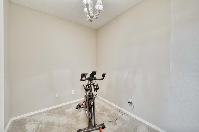 287 Appletree Dr, Ozark, MO 65721 - workout area featuring carpet flooring, baseboards, and a chandelier