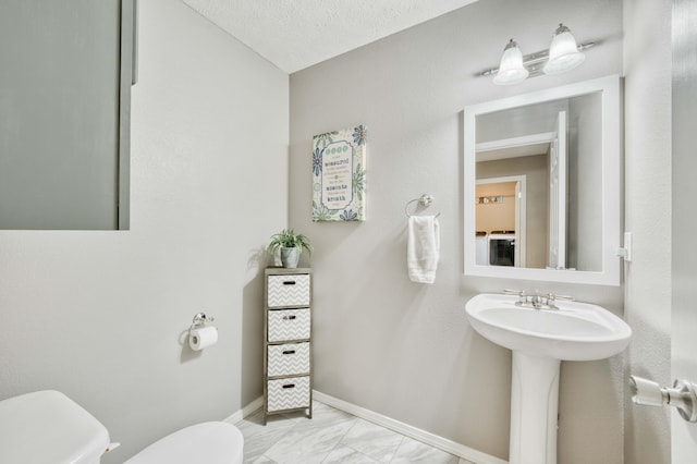 287 Appletree Dr, Ozark, MO 65721 - half bathroom with toilet, marble look tiles, and baseboards
