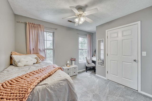 287 Appletree Dr, Ozark, MO 65721 - bedroom with baseboards, light colored carpet, a textured ceiling, and a ceiling fan