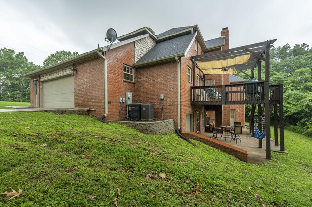 287 Appletree Dr, Ozark, MO 65721 - rear view of property featuring an attached garage, a pergola, brick siding, a lawn, and a wooden deck