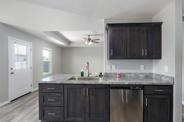 511 Mark St, Billings, MO 65610 - kitchen featuring stainless steel dishwasher, ceiling fan, light wood finished floors, light countertops, and dark brown cabinetry