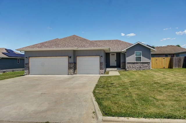 511 Mark St, Billings, MO 65610 - view of front facade featuring stone siding, an attached garage, concrete driveway, board and batten siding, and a shingled roof