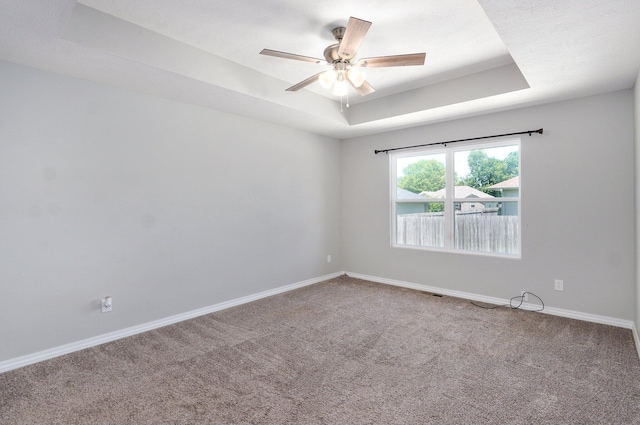 511 Mark St, Billings, MO 65610 - carpeted spare room with a raised ceiling and a ceiling fan