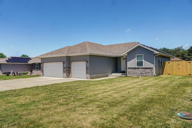 511 Mark St, Billings, MO 65610 - view of front of house with stone siding, an attached garage, concrete driveway, and roof with shingles