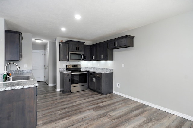 511 Mark St, Billings, MO 65610 - kitchen featuring stainless steel appliances, dark wood-style floors, and recessed lighting