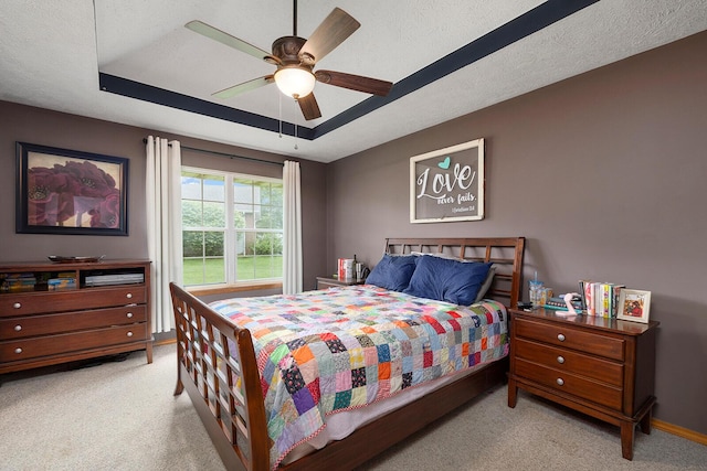 5204 W Turnberry Ct, Ozark, MO 65721 - carpeted bedroom featuring a tray ceiling, ceiling fan, and baseboards