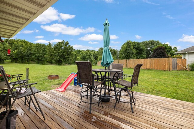 5204 W Turnberry Ct, Ozark, MO 65721 - wooden terrace with a fire pit and outdoor dining space