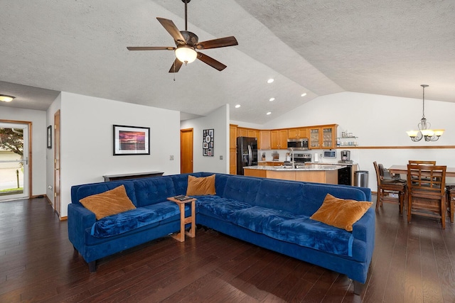 5204 W Turnberry Ct, Ozark, MO 65721 - living room with vaulted ceiling, ceiling fan, dark wood-style flooring, a textured ceiling, and a chandelier