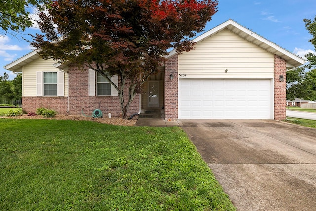 5204 W Turnberry Ct, Ozark, MO 65721 - single story home featuring brick siding, a front lawn, concrete driveway, and an attached garage