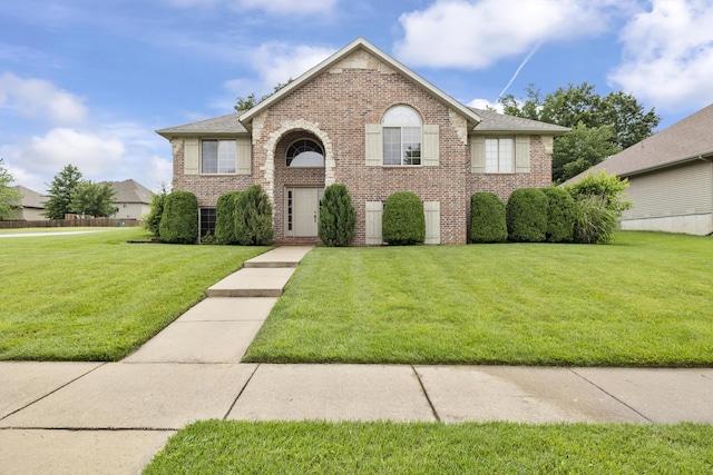 608 S Yellowwood Dr, Springfield, MO 65809 - traditional-style house featuring brick siding and a front yard