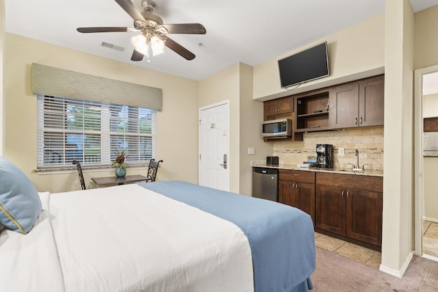 2800 Green Mountain Dr Unit 230, Branson, MO 65616 - bedroom featuring a sink, light carpet, baseboards, ensuite bathroom, and a ceiling fan