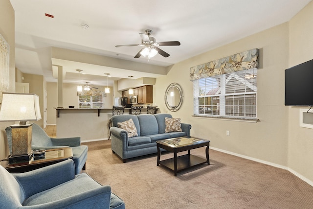 2800 Green Mountain Dr Unit 230, Branson, MO 65616 - living room with a ceiling fan, baseboards, and light carpet