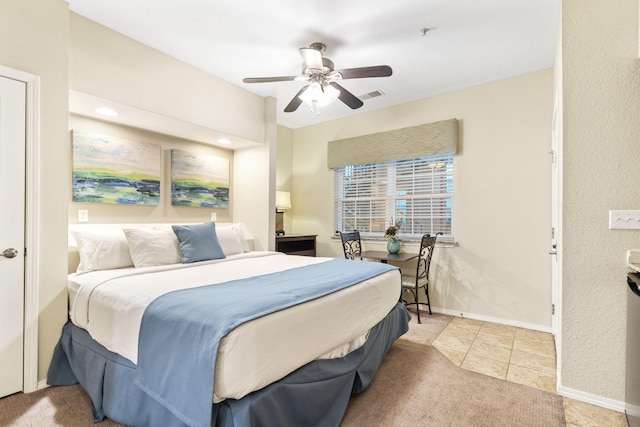 2800 Green Mountain Dr Unit 230, Branson, MO 65616 - tiled bedroom with ceiling fan and carpet floors