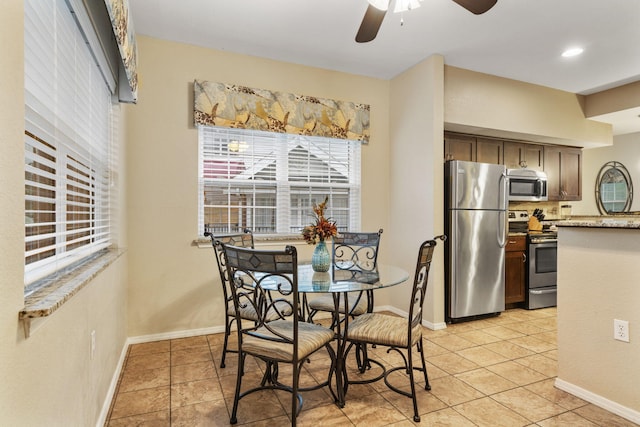 2800 Green Mountain Dr Unit 230, Branson, MO 65616 - dining room featuring ceiling fan, light tile patterned floors, and baseboards