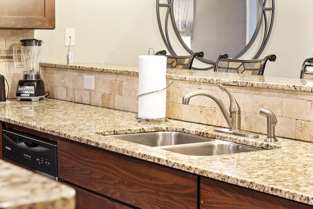 2800 Green Mountain Dr Unit 230, Branson, MO 65616 - kitchen featuring decorative backsplash, a sink, light stone counters, and dark brown cabinets