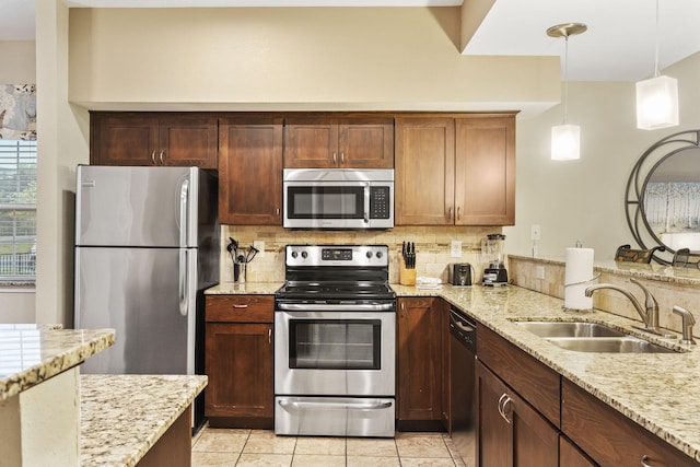 2800 Green Mountain Dr Unit 230, Branson, MO 65616 - kitchen featuring appliances with stainless steel finishes, a sink, tasteful backsplash, and light stone countertops