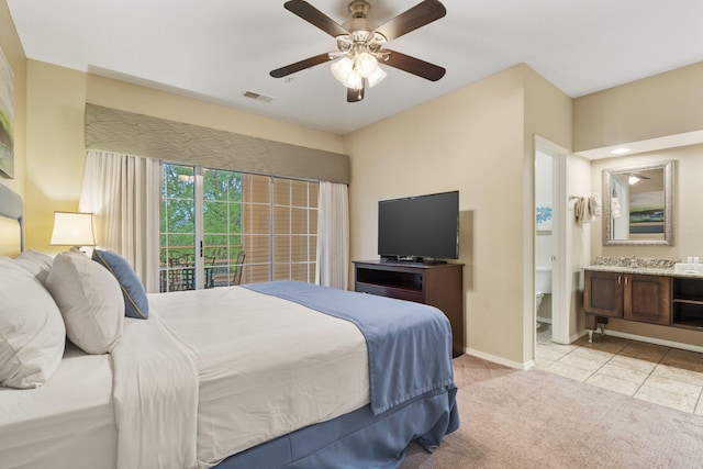 2800 Green Mountain Dr Unit 230, Branson, MO 65616 - bedroom with baseboards, light colored carpet, ensuite bath, ceiling fan, and light tile patterned floors