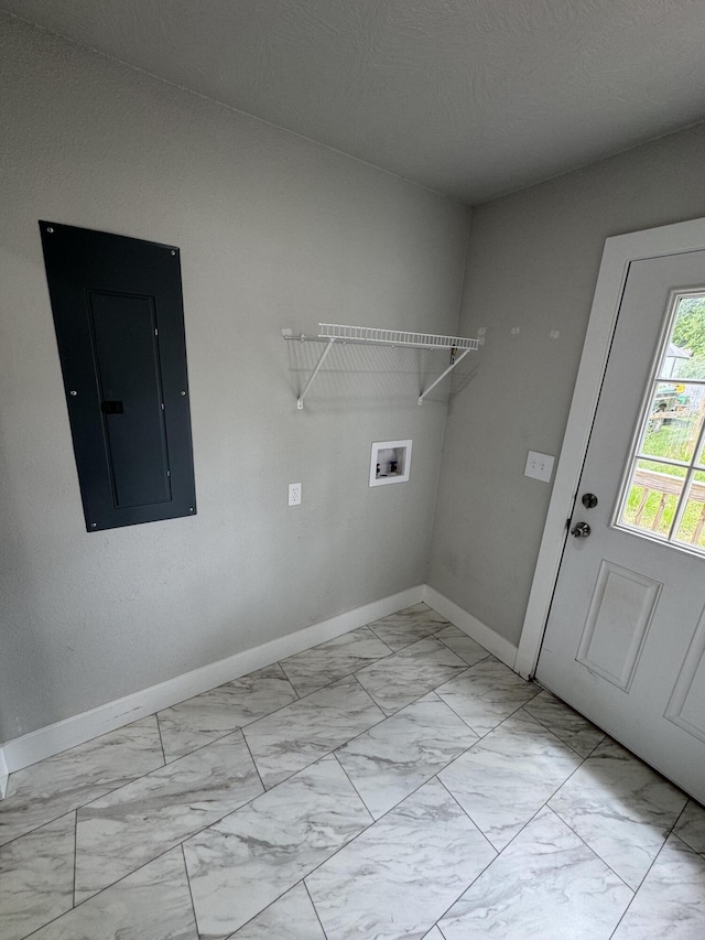 108 Jasper St, Aurora, MO 65605 - laundry room with electric panel, light marble finish floors, washer hookup, and baseboards