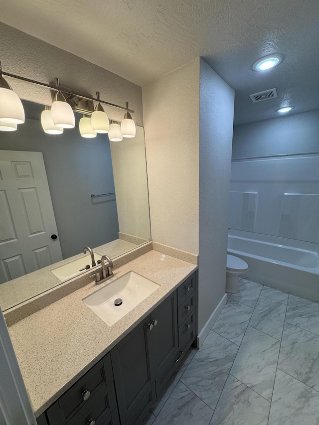 108 Jasper St, Aurora, MO 65605 - full bathroom with vanity, marble look tiles, toilet, recessed lighting, and bathtub / shower combination