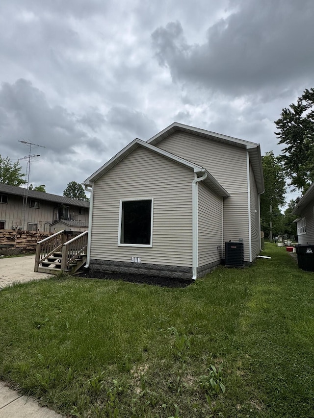 108 Jasper St, Aurora, MO 65605 - view of side of home with central AC unit and a yard