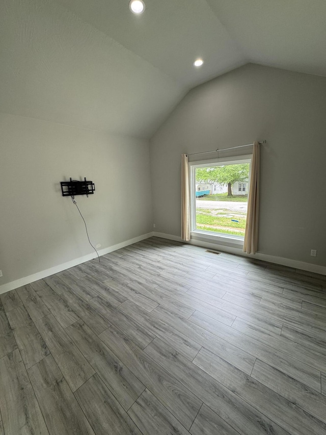 108 Jasper St, Aurora, MO 65605 - bonus room with wood finished floors, lofted ceiling, recessed lighting, and baseboards