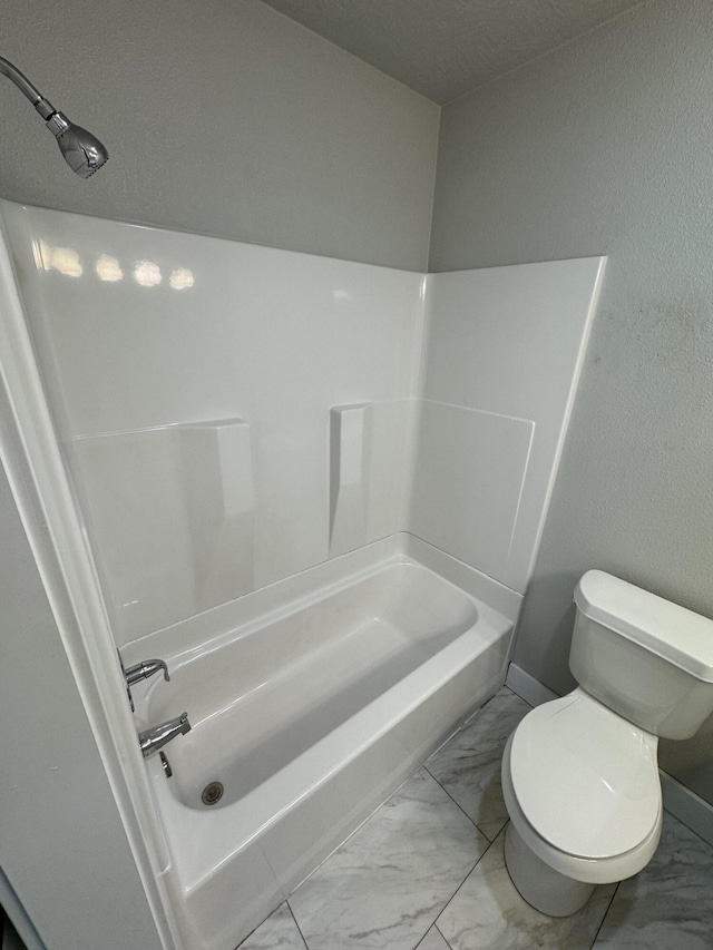 108 Jasper St, Aurora, MO 65605 - full bath with marble finish floors, toilet, and tub / shower combination