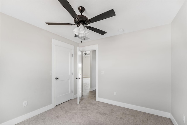 1312 N Maxine Ave, Nixa, MO 65714 - unfurnished bedroom with light carpet, baseboards, and a ceiling fan