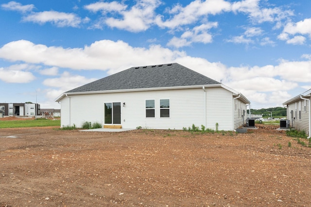 1312 N Maxine Ave, Nixa, MO 65714 - back of house featuring central AC and a shingled roof