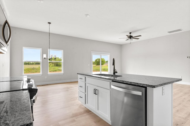 1312 N Maxine Ave, Nixa, MO 65714 - kitchen with stainless steel appliances, a sink, light wood-style floors, a ceiling fan, and white cabinets
