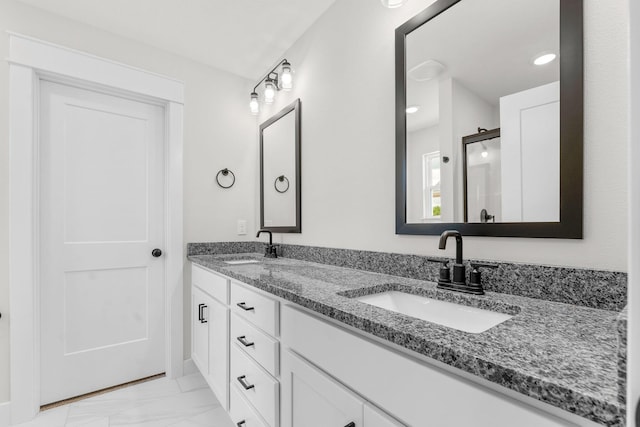 1312 N Maxine Ave, Nixa, MO 65714 - bathroom with marble finish flooring, double vanity, and a shower with shower door