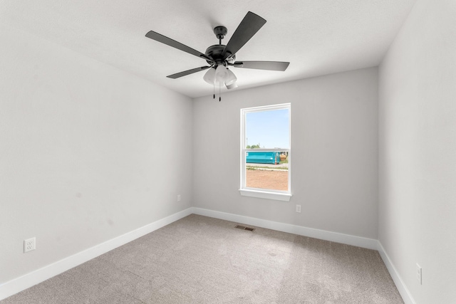 1312 N Maxine Ave, Nixa, MO 65714 - carpeted spare room with baseboards and a ceiling fan