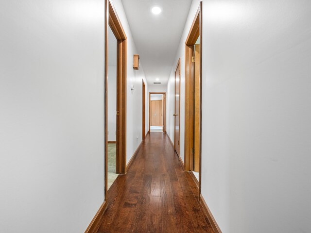 1622 Oakland Ave, Bolivar, MO 65613 - corridor with dark wood finished floors, recessed lighting, and baseboards