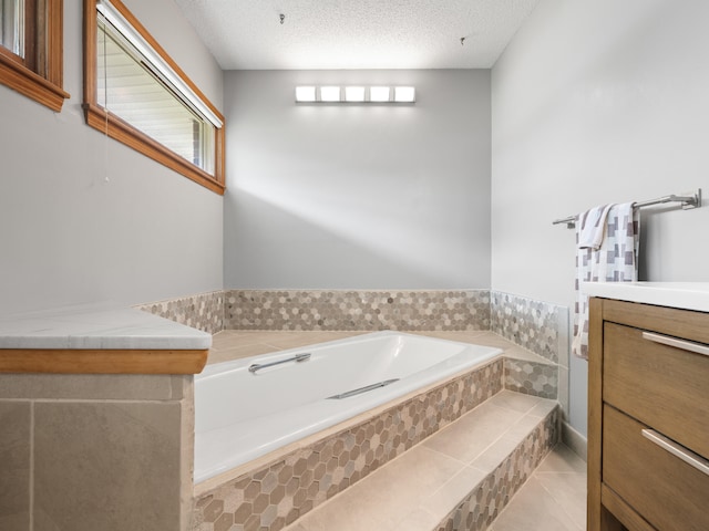 1622 Oakland Ave, Bolivar, MO 65613 - full bathroom featuring a garden tub, vanity, tile patterned flooring, and a textured ceiling