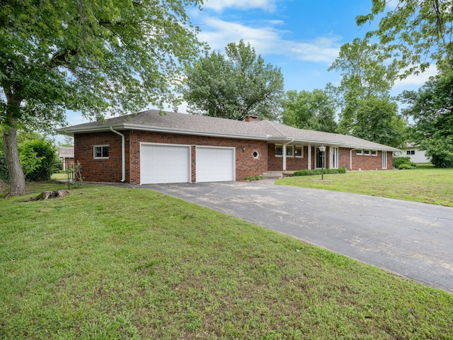 1622 Oakland Ave, Bolivar, MO 65613 - ranch-style house with an attached garage, asphalt driveway, a front lawn, brick siding, and a chimney