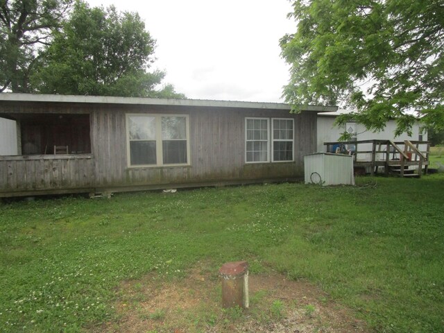 9065 County Road 3940, Mountain View, MO 65548 - rear view of property with a lawn and a deck