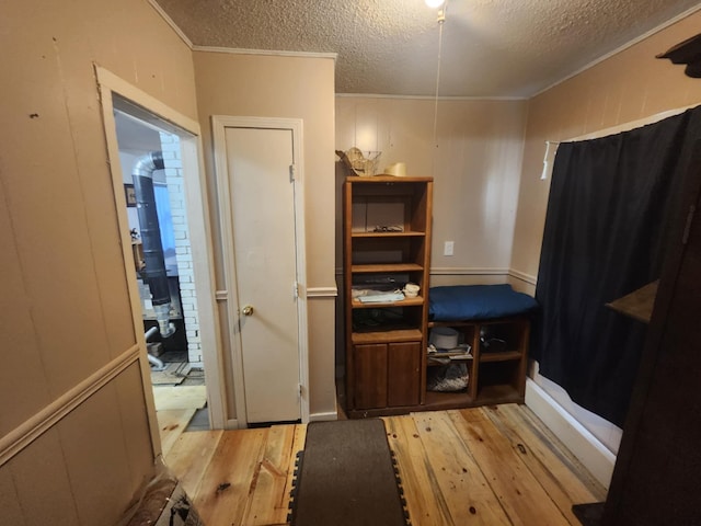 626 W N St, Mountain Grove, MO 65711 - bedroom featuring wood-type flooring, a textured ceiling, and ornamental molding