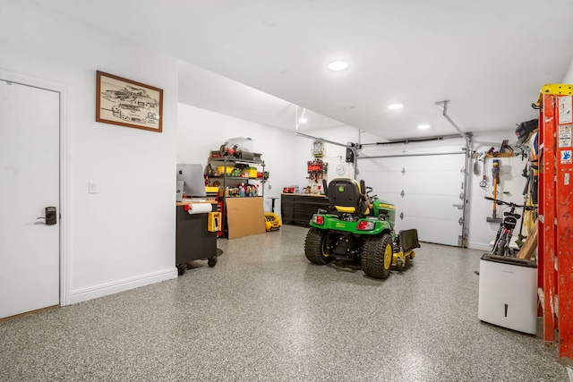 185 Appaloosa Trl, Saddlebrooke, MO 65630 - garage featuring recessed lighting, baseboards, and a workshop area