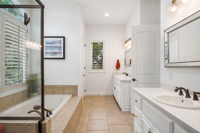 185 Appaloosa Trl, Saddlebrooke, MO 65630 - bathroom featuring two vanities, a bath, recessed lighting, and tile patterned floors
