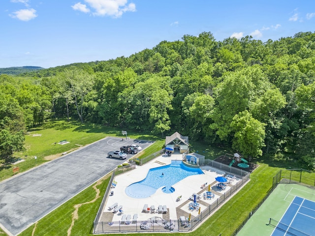 185 Appaloosa Trl, Saddlebrooke, MO 65630 - drone / aerial view of a heavily wooded area and a pool area
