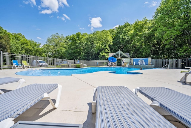 185 Appaloosa Trl, Saddlebrooke, MO 65630 - community pool with a patio and view of wooded area
