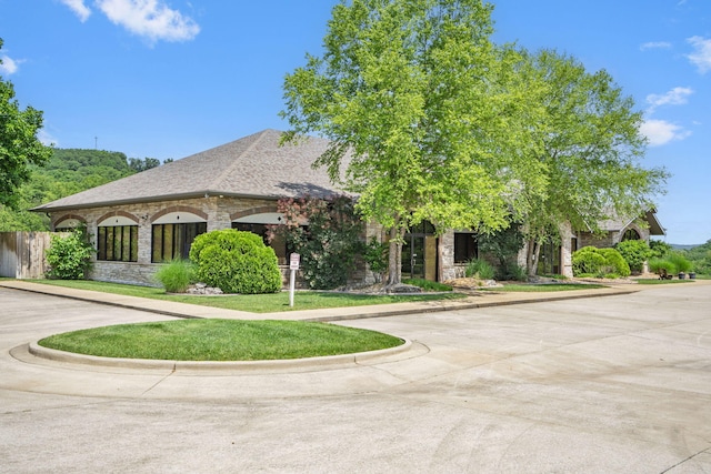 185 Appaloosa Trl, Saddlebrooke, MO 65630 - french country inspired facade featuring stone siding and curved driveway