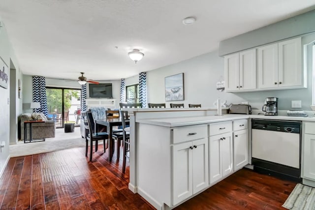 123 Bunker Ridge Dr Unit 4, Branson, MO 65616 - kitchen featuring dishwasher, a peninsula, dark wood finished floors, ceiling fan, and white cabinets