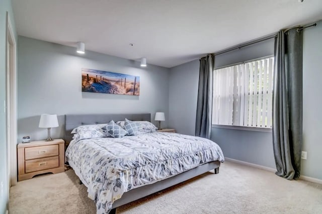 123 Bunker Ridge Dr Unit 4, Branson, MO 65616 - bedroom with light colored carpet and baseboards